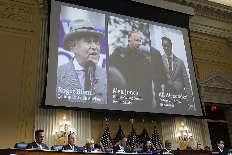 Photos of Roger Stone, Alex Jones and Ali Alexander appear on a screen during a Select Committee hearing on July 12, 2022.