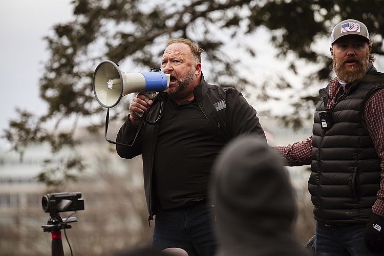 Alex Jones uses a bullhorn to speak to crowd on January 6, 2021.