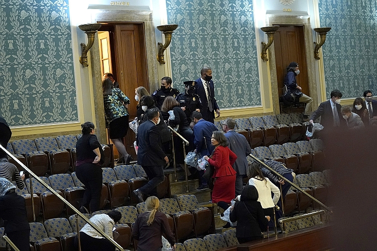 Members of Congress are evacuated from the House Chamber.