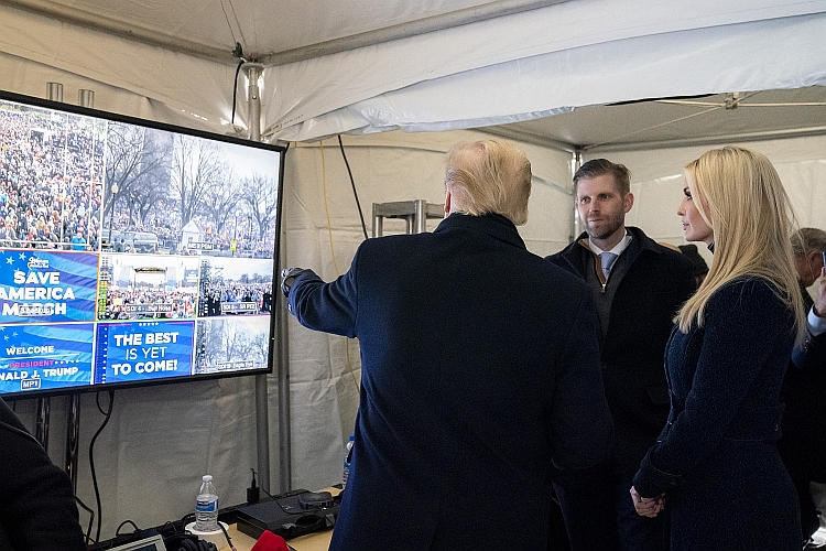 President Trump looks backstage at the crowd gathered at the Ellipse.