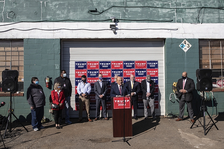 Rudolph Giuliani, Bernard Kerik, and other hold a press conference at Four Seasons Total Landscaping on November 7, 2020 falsely claiming Donald Trump had won the state of Pennsylvania.