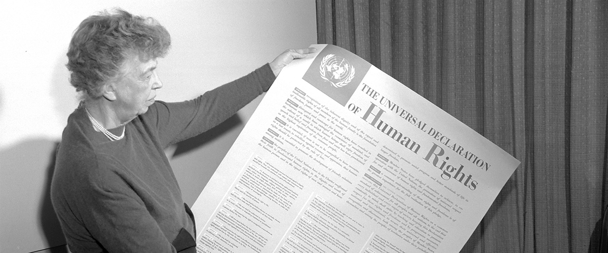 Mrs. Eleanor Roosevelt of the United States, chair of the drafting committee, holding a Universal Declaration of Human Rights poster in English. UN Photo (1949)