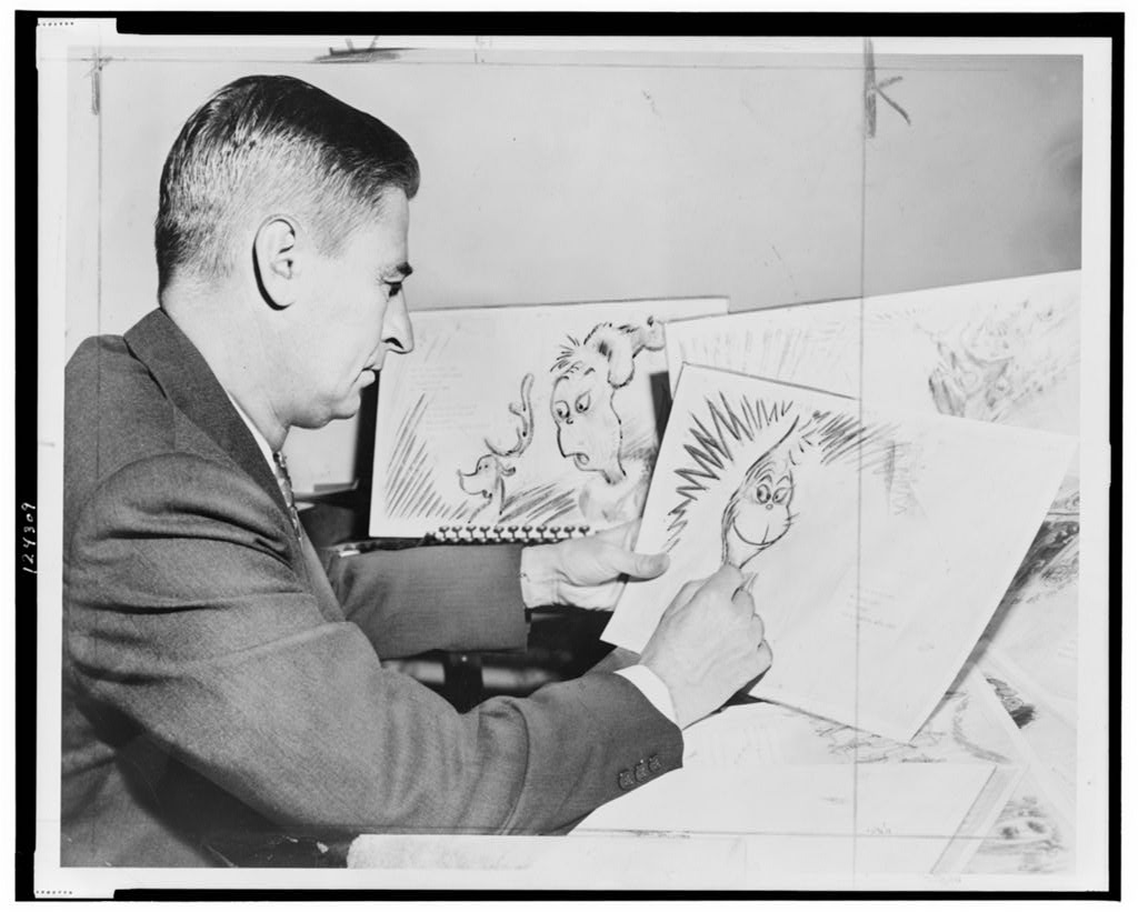 Dr. Seuss (Ted Geisel) at work on a drawing of a grinch, the hero of his forthcoming book, How the Grinch Stole Christmas
